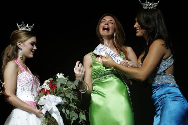 Christina Keegan, center, reacts after winning the 2009 Miss Nevada Pageant while Miss Nevada 2008, Julianna Erdesz, right, and Nevada's Outstanding Teen 2009, Alexis Hilts, left, congratulate her at the Pioneer Center for the Performing arts in Reno, NV, Saturday, June 27, 2009.