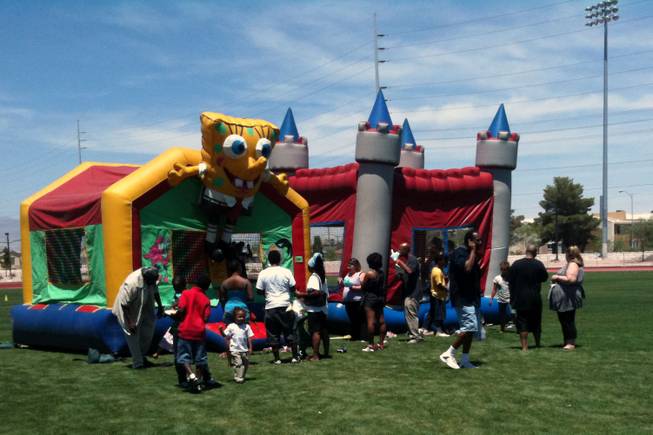 Children -- and some dads -- take advantage of the bounce houses at the Southern Nevada Regional Housing Authority's Father's Day celebration Saturday at the Pearson Community Center.