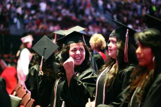 Natalie Vasquez, center, celebrated after receiving her diploma during the Chaparral High School graduation ceremony at the Orleans Arena in Las Vegas Monday, June 20, 2011.