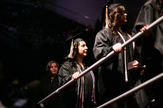 Natalie Vasquez, center, waits in line to walk during the Chaparral High School graduation ceremony at the Orleans Arena in Las Vegas Monday, June 20, 2011.
