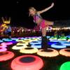 Dina Bronshteyn,31, of Orlando, Fla. jumps on lighted rings during the Electric Daisy Carnival at the Las Vegas Motor Speedway June 24, 2011.