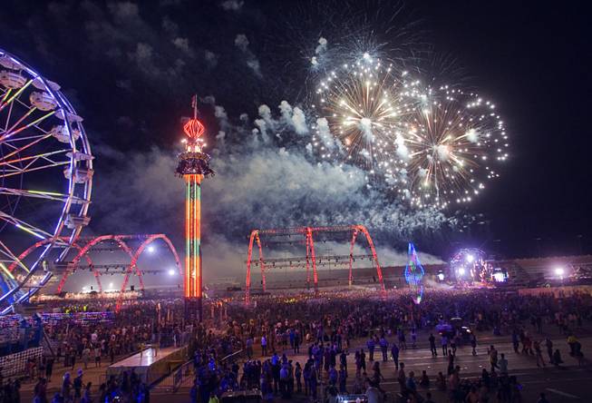 Fireworks explode over the Electric Daisy Carnival at the Las Vegas Motor Speedway Sunday June 26, 2011.