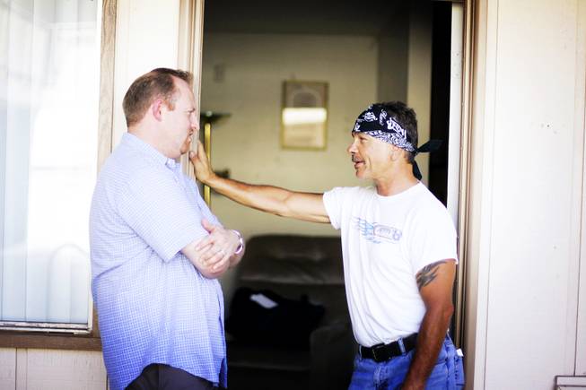 Jeff Iverson, left, talks with Daniel Moore, an outreach coordinator at Freedom House Sober Living apartments in Las Vegas Wednesday, June 29, 2011.