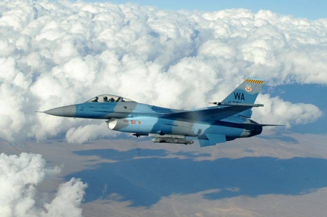 An F-16 Fighting Falcon Aggressor flies over the Nevada Test and Training Range Oct. 19, 2009. 