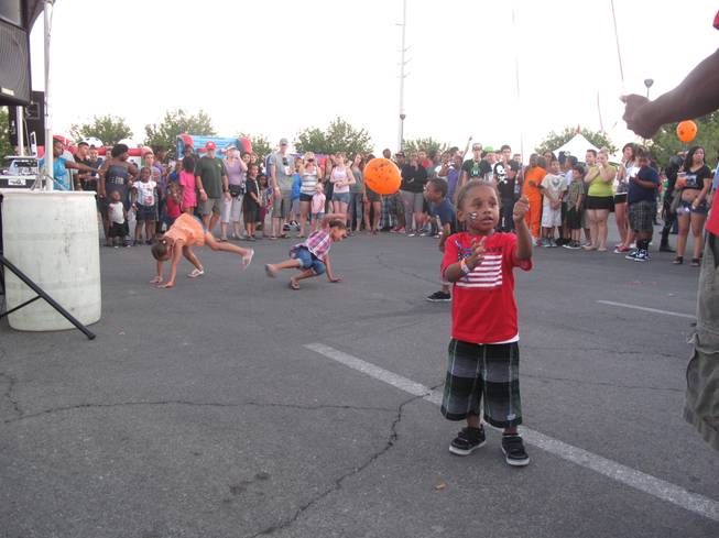Children dance while a DJ plays songs for the younger crowds at North Las Vegas' Independence Day Jubilee Saturday night. The city's annual event featured live music, food and fireworks and was expected to draw about 40,000 people. 
