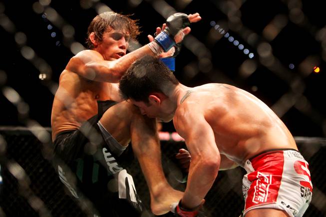 Dominick Cruz catches Urijah Faber's foot during their main event bout at UFC 132 Saturday at the MGM Grand Garden Arena.  Cruz won by unanimous decision.