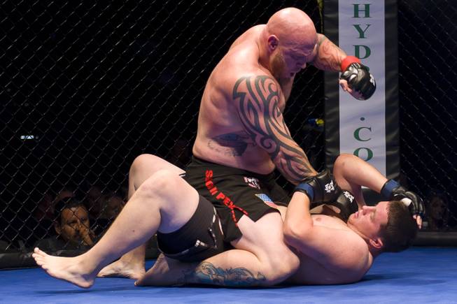 Carl Postma makes short work of Brandon Browning to earn the inaugural Tuff-N-Uff Randy Couture Heavyweight Belt at The Cox Pavilion July 1, 2011. 