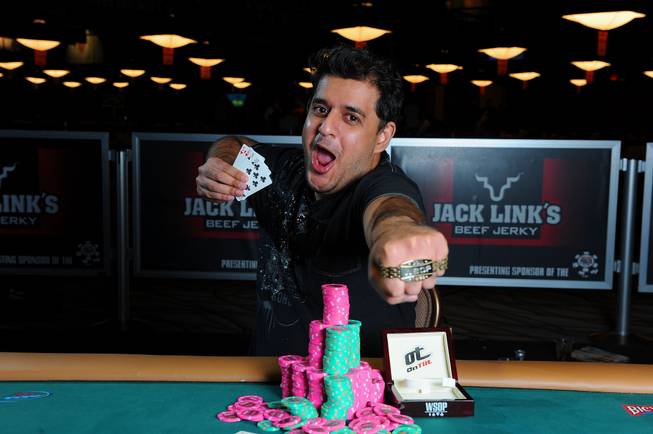 Owais Ahmed poses after winning a World Series of Poker tournament earlier this summer. Ahmed, a 28-year old from Anaheim, Calif., won a Omaha/Seven Card Stud High-Low mixed event for $255,959. 