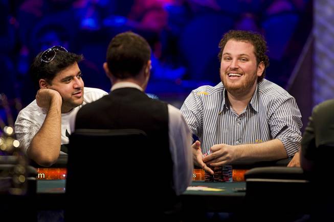 Owais Ahmed, left, and Scott Seiver compete at the final table of the $50,000 buy-in, Poker Player's Championship during the World Series of Poker at the Rio Wednesday, July 6, 2011.