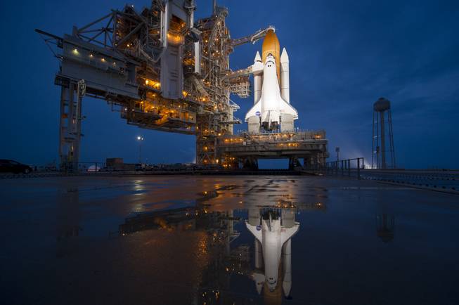 In this image provided by NASA the space shuttle Atlantis is seen shortly after the rotating service structure (RSS) was rolled back at launch pad 39a, Thursday, July 7, 2011 at the NASA Kennedy Space Center in Cape Canaveral, Fla. 