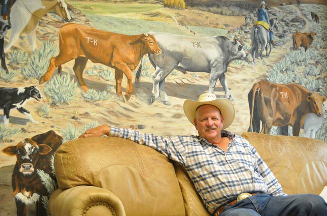 County Commissioner Tom Collins sits in his western-themed office.  