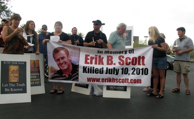 Friends and supporters mark the one-year anniversary of Erik Scott's death outside the Summerlin Costco, where he was fatally shot by Metro Police officers. 