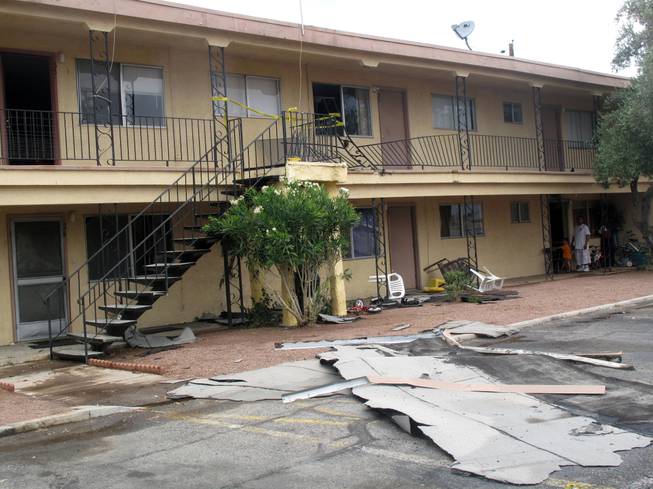 Heavy rain and strong winds tore a roof off a building in the Willow Gardens Apartments on Vegas Drive. The storm also slammed a metal railing into a second-floor unit, leaving a 2-year-old boy with minor injuries.