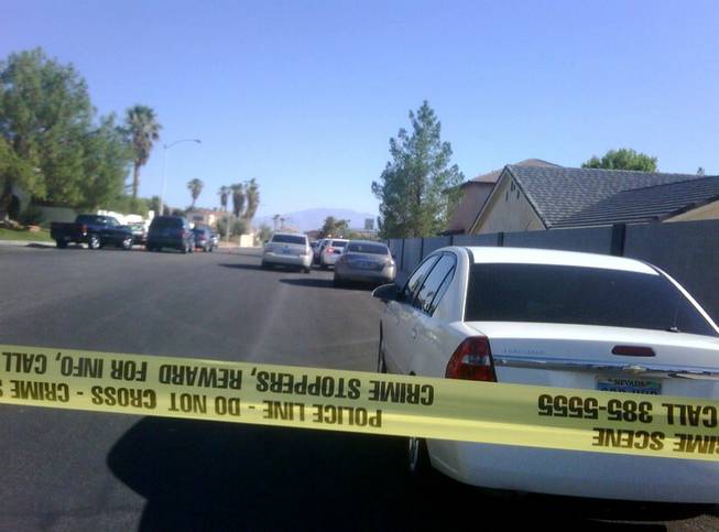 Metro Police investigate an officer-involved shooting Thursday morning in the western Las Vegas Valley. 