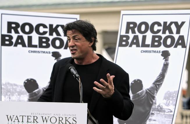 Actor Sylvester Stallone gestures at a news conference after a bronze statue of Stallone portraying the boxer Rocky Balboa from the film "Rocky III" was unveiled near the steps of the Philadelphia Museum of Art in Philadelphia, Friday, Sept. 8, 2006.
