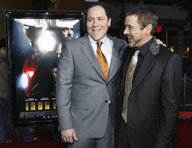 Robert Downey Jr., right, and director Jon Favreau pose together at the premiere of "Iron Man" in Los Angeles on Wednesday, April 30, 2008.