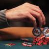 A competitor plays with his chips during play at the 2011 World Series of Poker Friday, July 15, 2011.