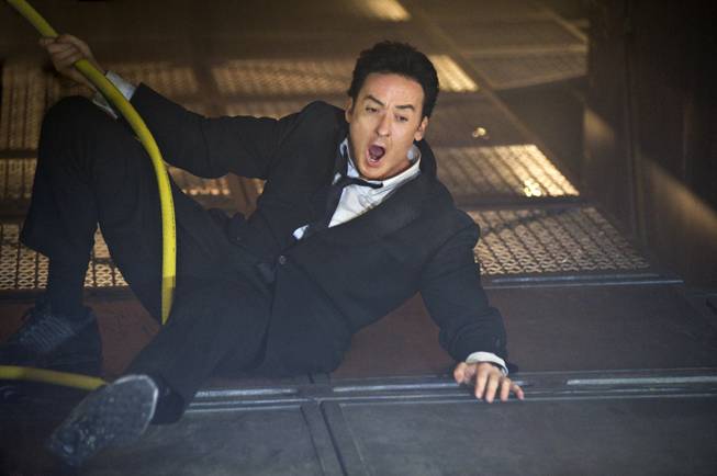 In this film publicity image released by Columbia Pictures/Sony, John Cusack is shown in a scene from "2012."