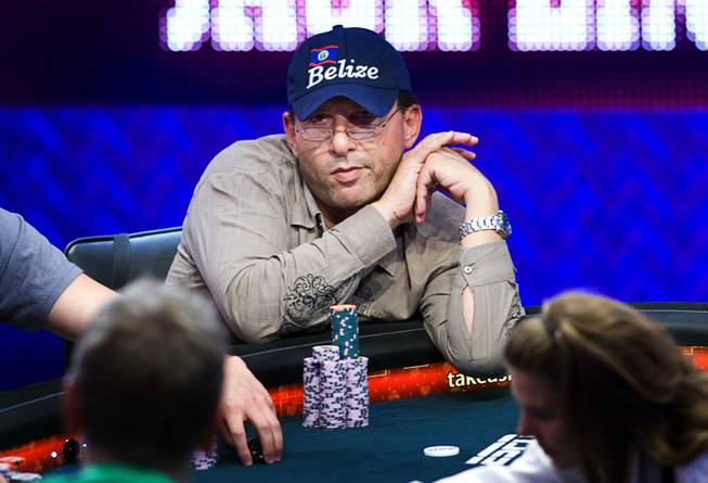 Badih Bounahra of Belize competes during Day 8 of the World Series of Poker $10,000 buy-in, no-limit Texas Hold 'em main event at the Rio Tuesday, July 19, 2011.