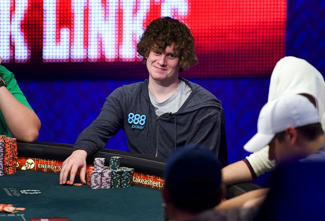 Sam Holden of Britain competes during Day 8 of the World Series of Poker $10,000 buy-in, no-limit Texas Hold 'em main event at the Rio Tuesday, July 19, 2011.