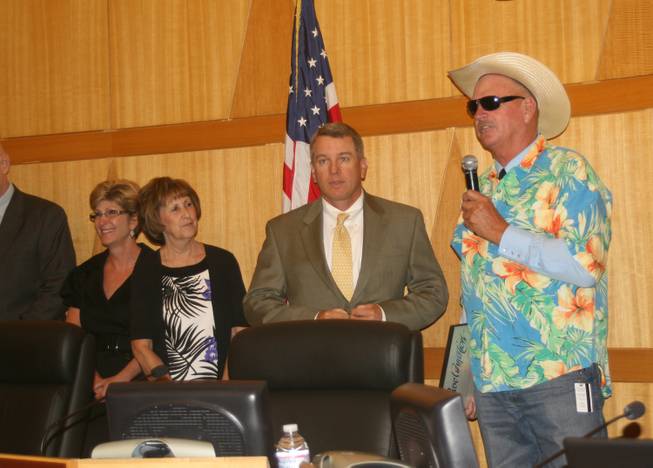 County Commissioner Tom Collins dresses for the occasion while giving a proclamation to the Las Vegas Motor Speedway over the success of the Electric Daisy Carnival. 