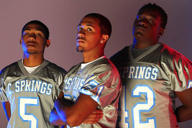 Canyon Springs High School football players D.J. Pumphrey, Andrew Lewis and Rayshawn Henderson.