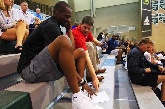 UNLV coaches Stacey Augmon and Dave Rice evaluate players on Friday, July 22, 2011 during the adidas Super 64 tournament at Rancho High School.
