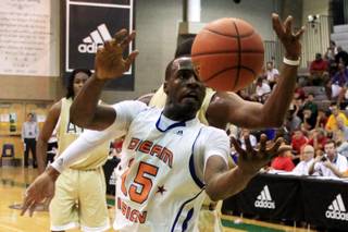 Dream Vision's Shabazz Muhammad reaches for a loose ball while taking on the Atlanta Celtics Friday, July 22, 2011 during the adidas Super 64 tournament.