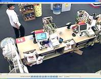 Photos from surveillance footage taken inside the CVS Pharmacy during an armed robbery. 