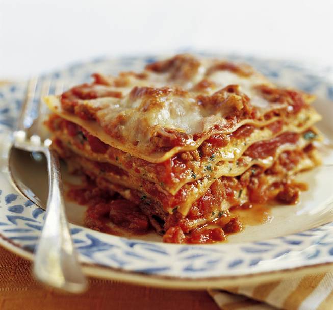 A delectably slimmed-down Meat and Cheese Lasagna, made with a recipe included in the cookbook "The Best Light Recipe," from the editors of Cook's Illustrated magazine. It uses lean ground turkey, as well as low-fat cheeses. 