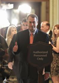 House Speaker John Boehner of Ohio gives a thumbs-up as he leaves the House Chamber on Capitol Hill in Washington, Friday, July 29, 2011, after House passage of his debt-limit legislation that was rewritten overnight to win the support of conservative holdouts. 