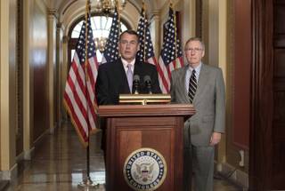 Speaker of the House John Boehner, R-Ohio, left, and Senate Republican leader Mitch McConnell of Kentucky, appear at a news conference as the debt crisis goes unresolved on Capitol Hill in Washington, Saturday, July 30, 2011.