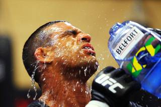 Vitor Belfort douses his head with water while working out in preparation for his upcoming fight against Yoshihiro Akiyama Saturday, July 30, 2011.
