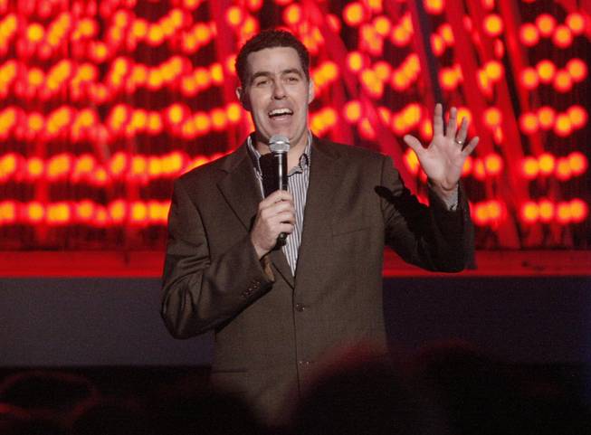 Comedian Adam Carolla hosts the LA Live entertainment complex holiday tree lighting ceremony in Los Angeles on Thursday, Dec. 4, 2008. 