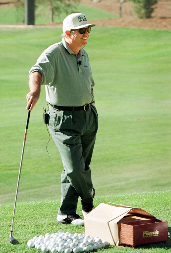 Butch Harmon, Tiger Woods' coach, gives golfing instructions at the opening of the Desert Pines golf course in February of 1997.