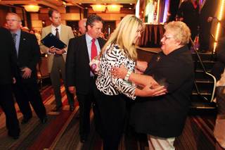 Jill Lagan greets former Henderson Chamber of Commerce President and CEO Alice Martz after the chamber's State of the Chamber luncheon Friday, Aug. 5, 2011, at the M Resort.