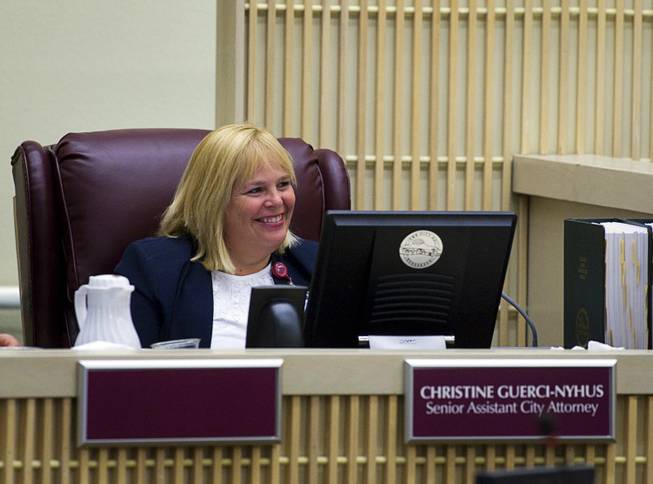 Acting city attorney Christine Guerci-Nyhus smiles as council members struggle with pronouncing her last name during a special meeting of the Henderson City Council Monday, August 8, 2011. The council named Guerci-Nyhus as interim city attorney.