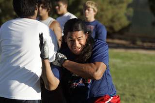 Kimo Seau practices during Liberty High School football practice in Henderson on Thursday, August 4, 2011.