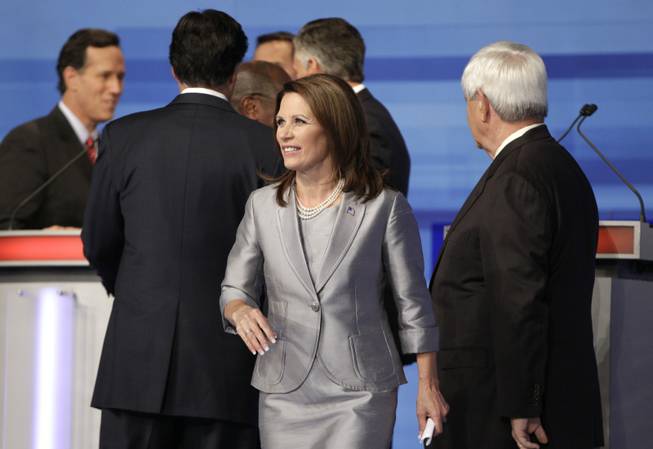 Republican presidential candidate Rep. Michele Bachmann, R-Minn. walks away from her fellow GOP candidates at the end of the Iowa GOP/Fox News Debate at the CY Stephens Auditorium in Ames, Iowa, Thursday, Aug. 11, 2011.