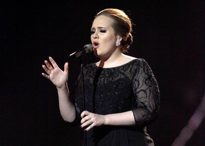 In this Feb. 15, 2011, photograph, Adele performs during the Brit Awards 2011 at The O2 Arena in London. 