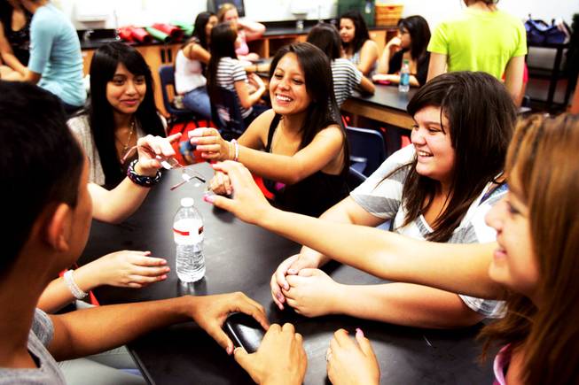 Student council member and junior Brenda Vargas, clockwise from center, sophomore Isabella Munguia, junior Betzabe Sanchaz and junior Alan Rivas joke around during a student council retreat at Western High School in Las Vegas Friday, August 19, 2011.