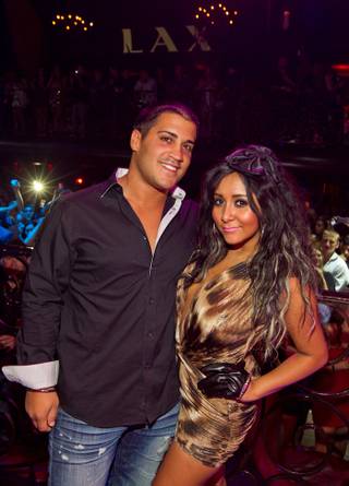 Snooki, with Jionni LaValle, hosts at LAX in the Luxor on Aug. 20, 2011.