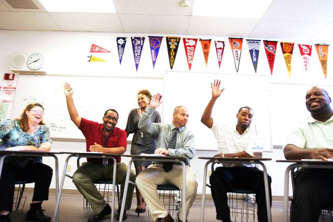 Math teachers raise their hands to vote during a department meeting at Mojave High School in North Las Vegas on Wednesday, August 24, 2011.