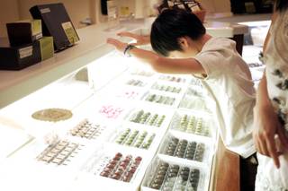 Jeremy Law, 11, of Los Angeles gets a good look at chocolates for sale at Ethel M Chocolate Factory in Henderson Thursday, August 25, 2011.