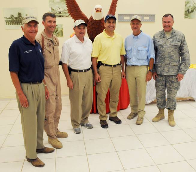Governors from Kentucky, Nevada, Tennessee and Utah pose for a photo with service members at Joint Base Balad, Iraq. The governors met with their deployed constituents and answered questions.