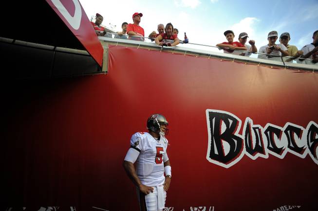 Tampa Bay Buccaneers quarterback Josh Freeman waita in the tunnel before taking to the field to take on the New England Patriots during an NFL preseason football game Thursday, Aug. 18, 2011, in Tampa, Fla.