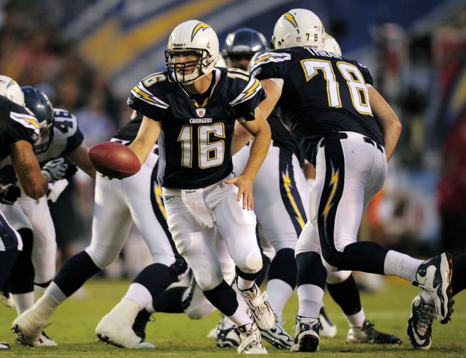 San Diego Chargers quarterback Scott Tolzien hands off while playing the Seattle Seahawks during the second half of their preseason NFL football game at Qualcomm Stadium Thursday, Aug. 11, 2011, in San Diego. 