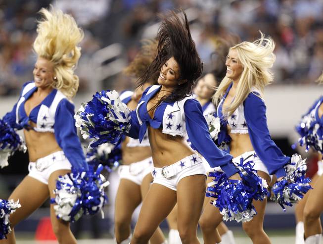 Dallas Cowboys cheerleaders perform during of a preseason NFL football game against the San Diego Chargers Sunday, Aug. 21, 2011, in Arlington, Texas. San Diego won the game 20-7. 