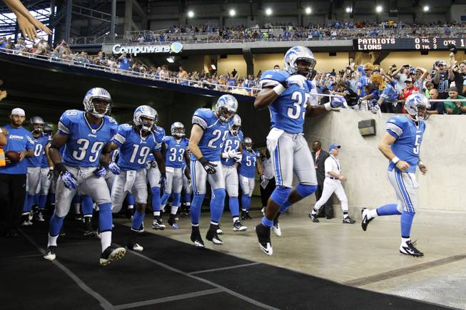 Detroit Lions players take the field before a preseason NFL football game against the New England Patriots in Detroit, Friday, Aug. 27, 2011.