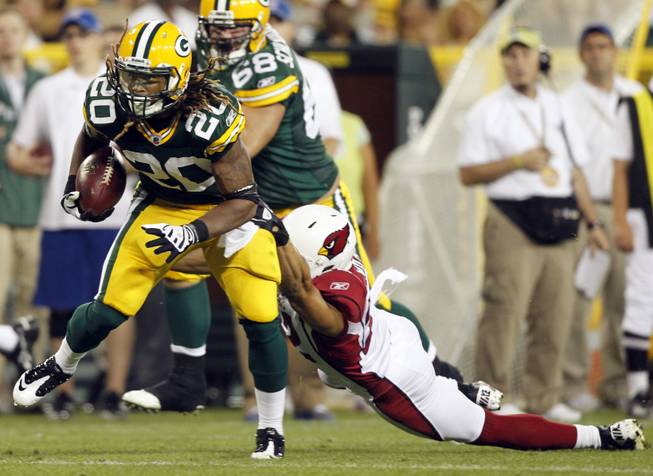 Arizona Cardinals' Matt Ware tries to stop Green Bay Packers' Alex Green (20) after a catch during the first half of an NFL preseason football game Friday, Aug. 19, 2011, in Green Bay, Wis.